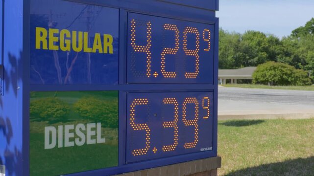 Fuel Prices Displayed at Gas Station in Urban Setting During Day. Price Sign is Symbol of Volatile Energy Market Global Cost of Oil. High Inflation in USA. Greer, SC, USA - May 5, 2026.