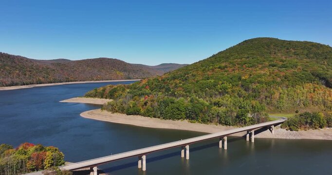 Autumn aerial video of the bridge of the Cannonsville Reservoir, Delaware County, NY, NYC DEP water supply, October 2025.