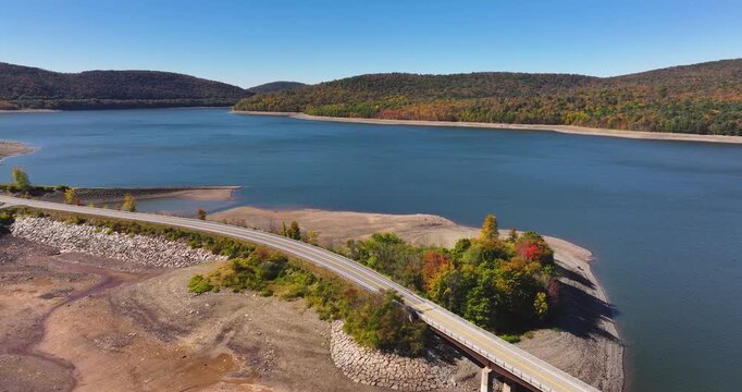 Autumn aerial video of the bridge of the Cannonsville Reservoir, Delaware County, NY, NYC DEP water supply, October 2025.
