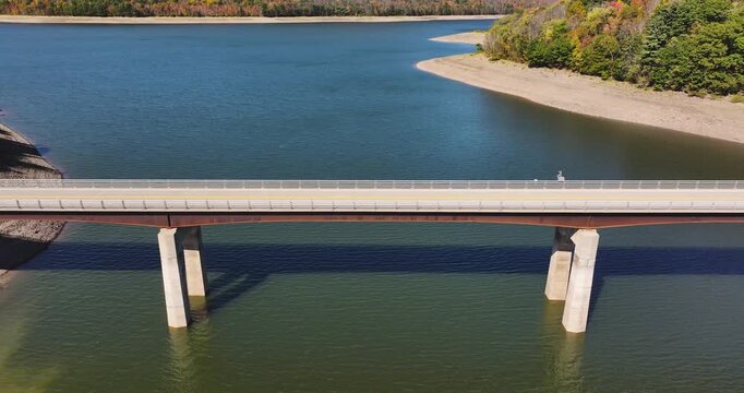 Autumn aerial video of the bridge of the Cannonsville Reservoir, Delaware County, NY, NYC DEP water supply, October 2025.