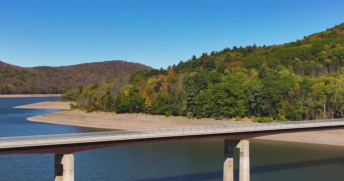 Autumn aerial video of the bridge of the Cannonsville Reservoir, Delaware County, NY, NYC DEP water supply, October 2025.