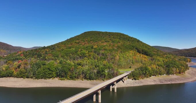 Autumn aerial video of the bridge of the Cannonsville Reservoir, Delaware County, NY, NYC DEP water supply, October 2025.