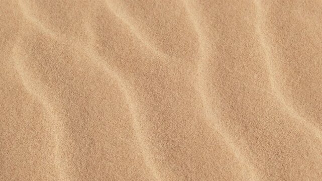 Close-up of fine sand texture with soft wind patterns, natural abstract background representing desert or beach surface, minimalistic design concept with warm tones