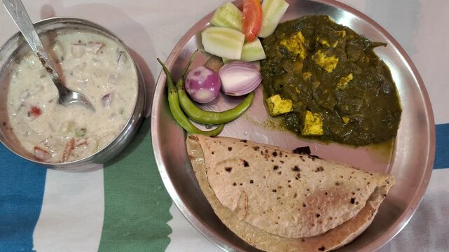 Authentic Indian Thali with Palak Paneer, Roti, and Raita