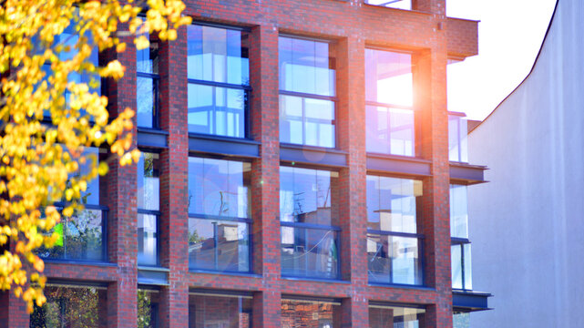 European residential architecture harmonizing with nature. Eco-friendly living in city with greens. Eco apartment building saving energy and fresh air concept. 