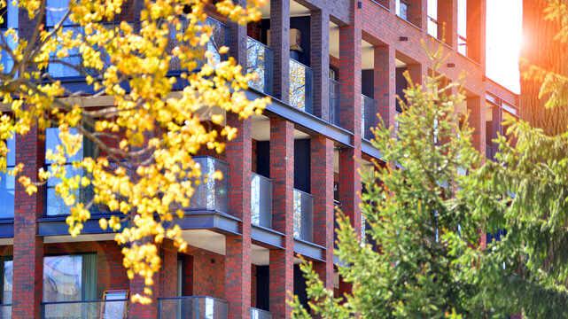 European residential architecture harmonizing with nature. Eco-friendly living in city with greens. Eco apartment building saving energy and fresh air concept. 