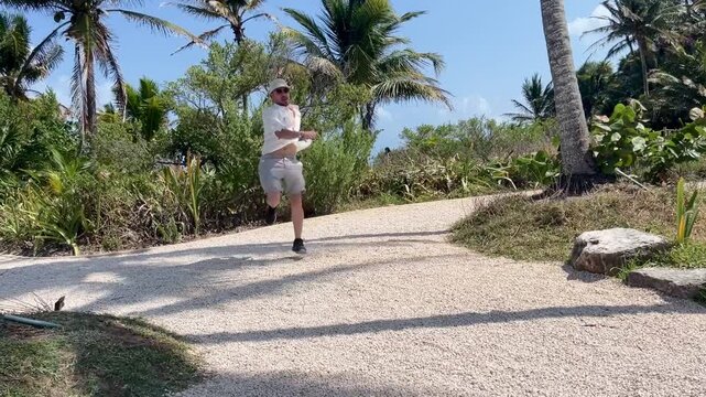 Joyful man performing jumpstyle dance in nature