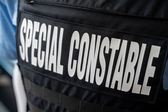 Close up of special constable text on police uniform vest.