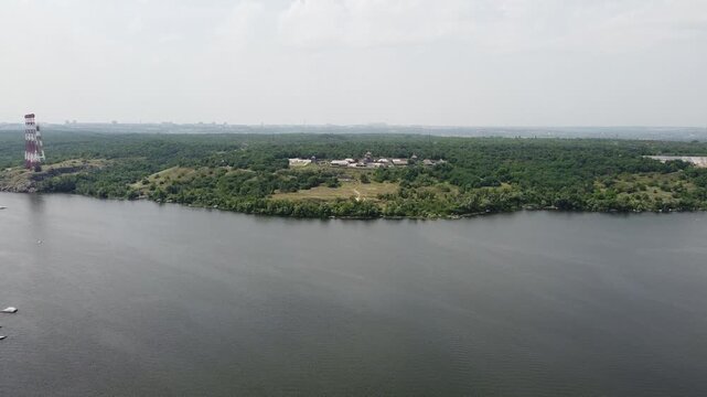 Horizontal drone footage of Khortytsia Island in Zaporizhzhia, Ukraine, showcasing the historic site of the Zaporizhian Sich, home of ancient Cossack settlements