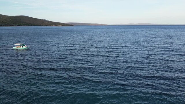 Aerial View of Small Fishing Boat Passing on Sea in Izmir Turkiye