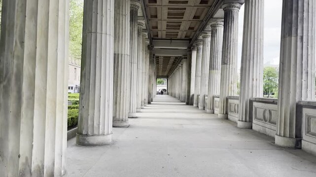 Long classical colonnade with stone pillars at the Museum Island in Berlin. The Colonnade Courtyard Kolonnadenhof near the Old National Gallery.
