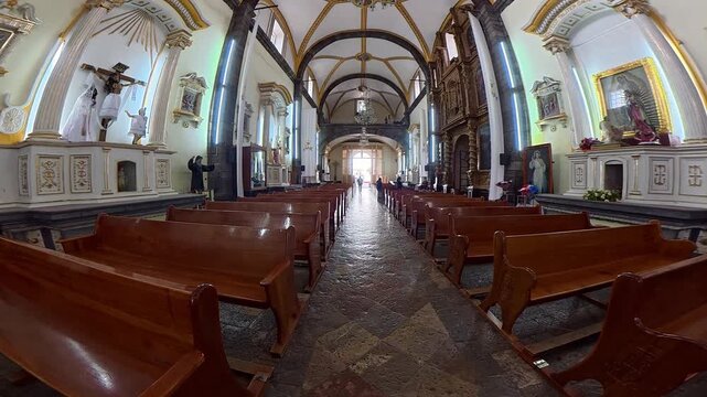 Walking down the main aisle of a historic mexican church