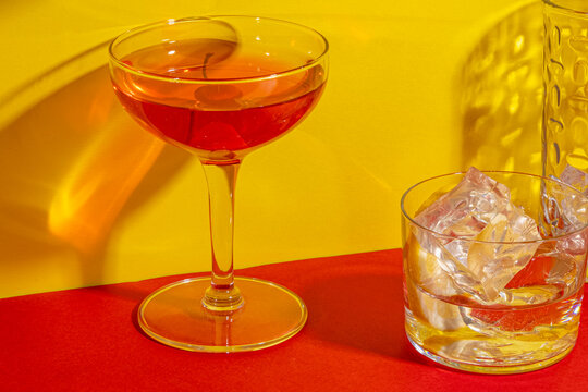 Cocktails on red and yellow with shadows