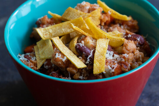 Bowl of Vegetarian Chili with chips and cheese