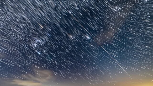 Orion constellation startrails with airplane and satellite trails. Time-lapse video.