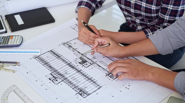 Close up hands of Architect and engineer. Team discussion about building construction. design brainstorming, sharing, talking about Structural design.