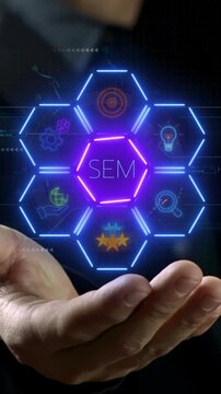 SEM or Search Engine Marketing concept for search engine optimization marketing ranking on website. Traffic website technology communication. Businessman showing SEM icons on virtual screen.