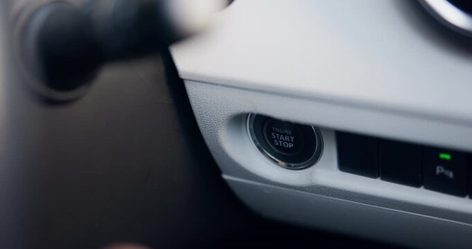 Hand, person and car with button to start engine, keyless ignition and quick access for travel. Finger, driver and dashboard interior with auto control, power feature and luxury vehicle for journey