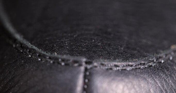 black hard leather from shoes, details of leather elements of shoes from their natural materials, hard