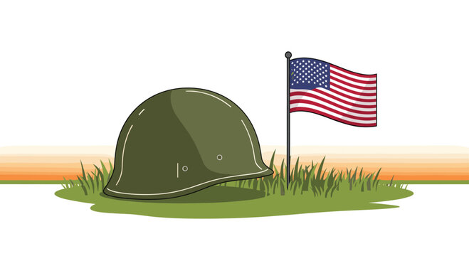 A classic green military helmet rests on a patch of green grass next to a small waving American flag against a warm sunset sky.