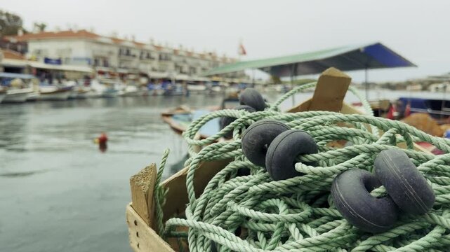 Traditional Fishing Nets Stacked on a Wooden Boat Deck