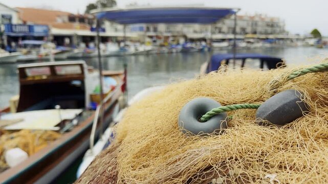Traditional Fishing Nets Stacked on a Wooden Boat Deck