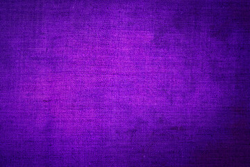 Fototapeta premium Bright purple fabric fills the space and creates a smooth surface for design projects or textile crafts in a workshop setting