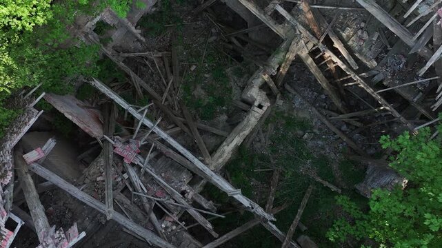 Aerial ruins historic manor house Poland climb inside. Drawsko northern Poland. Farm manor house in rural country farming landscape and economy. Abandoned after a century use, wealthy land owner.