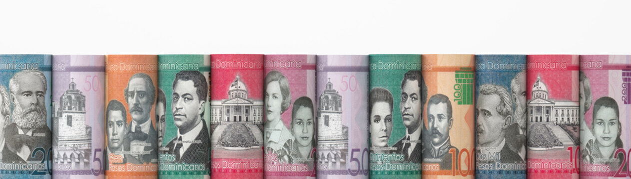 Close-up of Dominican Peso banknotes rolled in a row
