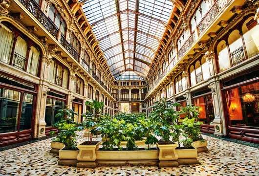 Galleria Subalpina Designed by Pietro Carrera in 1873, it is a historic shopping arcade featuring a striking iron and glass roof that fills the space with natural light,  Turin, Northern Italy, Europe