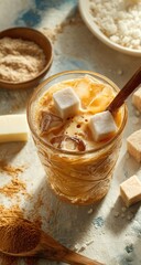 Fototapeta premium Iced, creamy drink with sugar cubes and ice