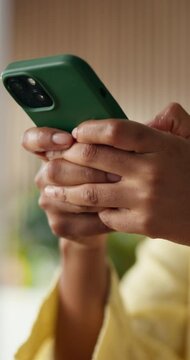 Hands, phone and texting with contact at startup, typing and project for graphic design job in office. Person, designer or scroll for proposal, chat or logo feedback with mobile app at digital agency