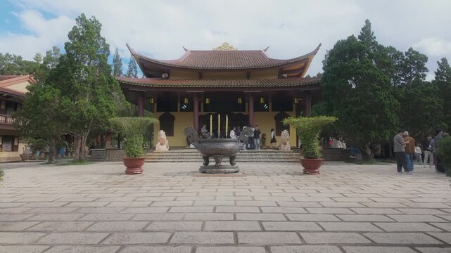 DALAT, VIETNAM, 5 November 2025 &ndash; A group of tourists visit the Truc Lam Zen Monastery, a serene Buddhist temple known for its beautiful architecture and gardens.