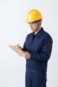 Half-body worker slightly leaning forward as if explaining something, natural expression, wearing proper workwear