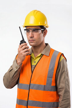 Half-body worker slightly leaning forward as if explaining something, natural expression, wearing proper workwear