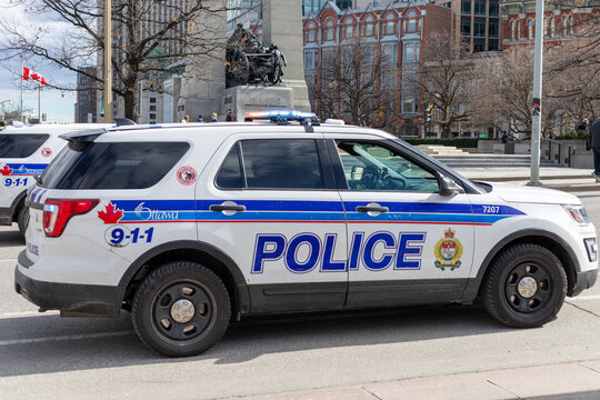 Ottawa, Canada - April 6, 2024: Ottawa Police vehicle near War Memorial. Law enforcement patrol car on the road of Canadian capital city