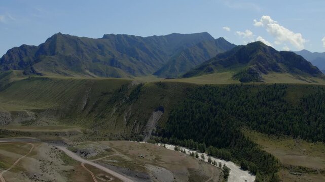 Drone footage of mountain valley and river channel near the confluence of the Chuya and Katun rivers, Altai Republic, Russia, on a sunny summer day