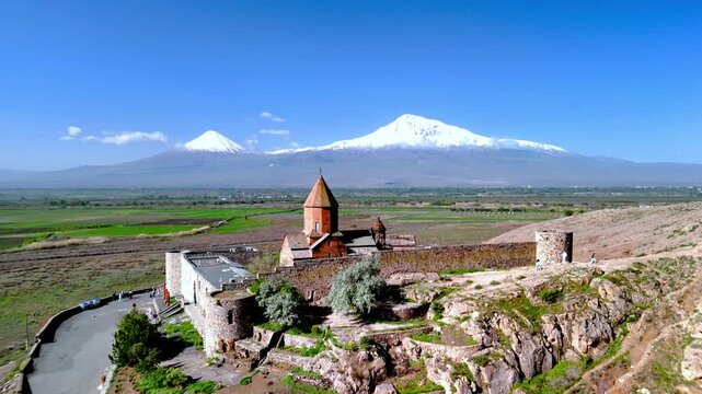 Aerial view of Khor Virap monastery with its historic stone walls and conical dome set against the snow-capped peaks of Mount Ararat in Pokr Vedi, Ararat Province, Armenia.