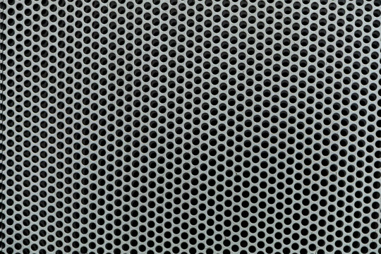 High-Density Perforated Metal Sheet Texture Background
