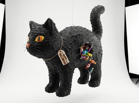 Black cat pi ata filled with candy for halloween celebration