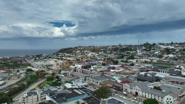 Aerial pulling away drone view of Mossel Bay city center, South Africa.