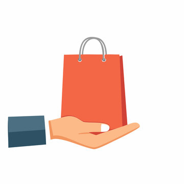 Hand holding a shopping bag
