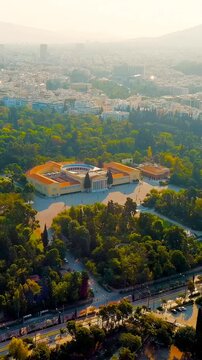 Vertical video. Athens, Greece. Zappion is a building in the classical style. Built by the Austrian architect Theophil von Hansen (1813 - 1891). Zappion completed in 1888. Drone footage, Point of int