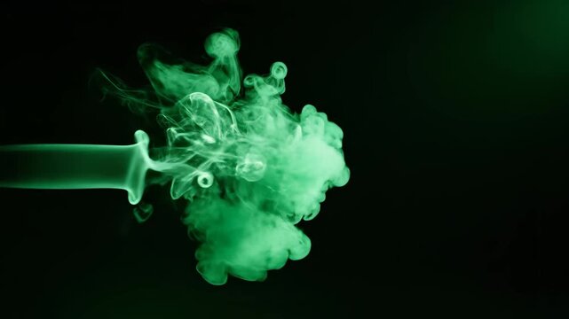 A mesmerizing stream of vibrant green smoke expands and swirls dynamically against a deep black backdrop.