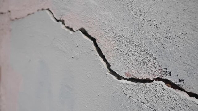 Crack in wall shows damage and need for repair work