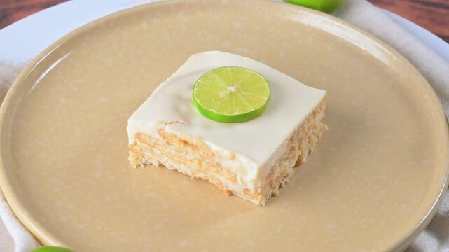Mexican lime icebox cake. Close-up of a square slice of lemon charlotte