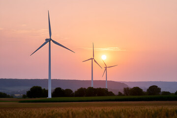 Obraz premium Renewable Energy Wind Turbines In Field At Sunset