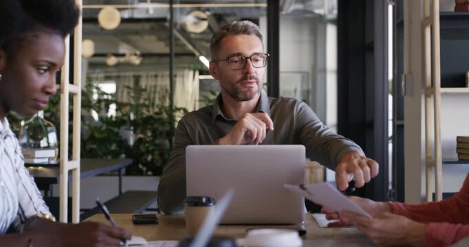 Leadership, paperwork and business people meeting, man or chief editor listening to article ideas, press research or story information. Project management, group and reporter teamwork on journalism