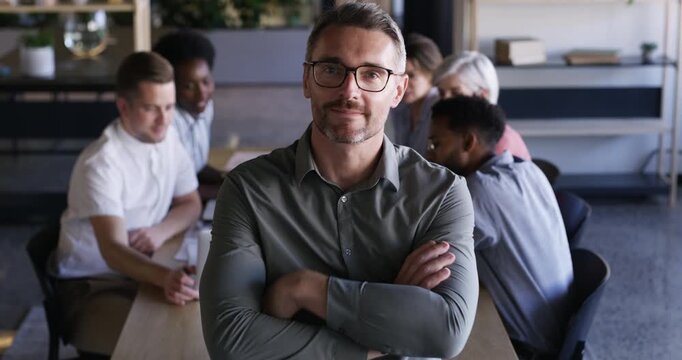 Meeting, arms crossed and happy business man face, team expert or project manager for group collaboration leadership. Boardroom portrait, agency boss or professional CEO confident in staff commitment
