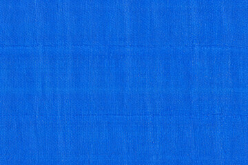 Blue tarpaulin texture with woven plastic pattern and glossy waterproof surface. Ideal for...